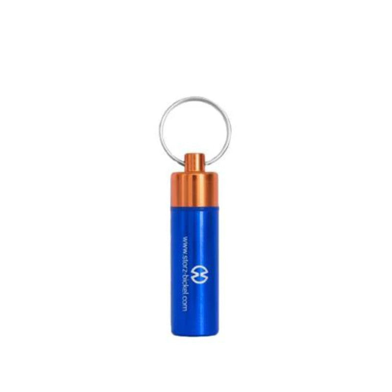 Storz & Bickel Capsule Caddy in blau mit Schlüsselanhänger für sichere Aufbewahrung von Dosierkapseln.