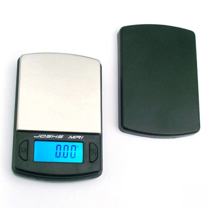 Digitale Feinwaage Josh's MR1 mit Edelstahloberfläche und LCD-Display für präzise Messungen bis 100 g.
