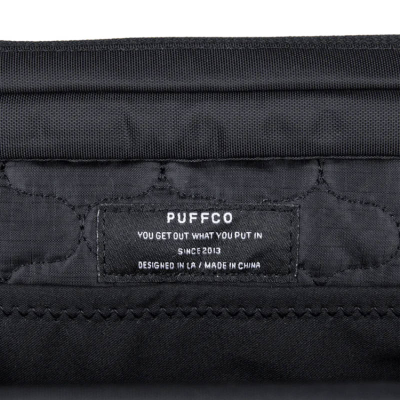 Puffco label inside the Proxy Travel Bag, showcasing design and manufacturing details.