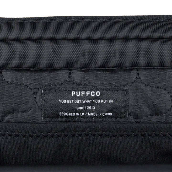 Puffco label inside the Proxy Travel Bag, showcasing design and manufacturing details.