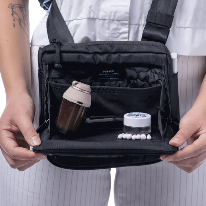 Proxy Travel Bag with organized compartments for accessories and portable Puffco device.