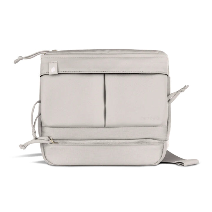 Proxy Travel Bag in light gray, featuring multiple compartments for organized storage and quick access.